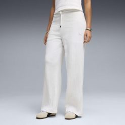 Damskie spodnie z wysokim stanem i szerokimi nogawkami HER PUMA. Białe spodnie materiałowe damskie Puma, do biegania. Za 249.00 zł.