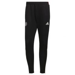 Spodnie treningowe Manchester United Tiro 2021/22. Czarne spodnie materiałowe męskie Adidas, bez wzorów, z materiału, klasyczne. Za 203.85 zł.