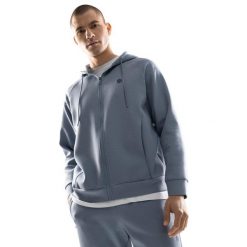 Męska rozpinana bluza treningowa z kapturem Fitness Siroko Surpass. Niebieskie bluzy sportowe męskie SIROKO, bez wzorów, z materiału, bez kołnierzyka, bez ramiączek. W wyprzedaży za 146.95 zł.