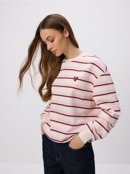 Bluza z drobnym haftem - pastelowy róż. Czerwone bluzy bez kaptura damskie Reserved, l, z bawełny. W wyprzedaży za 49.99 zł.