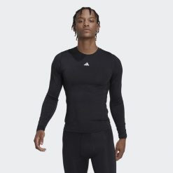 Koszulka z długim rękawem męska adidas Techfit. Czarne koszulki męskie z długim rękawem Adidas, m, z materiału. Za 136.99 zł.