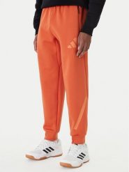 Adidas Spodnie dresowe Z.N.E. KE4686 Pomarańczowy Regular Fit. Brązowe spodnie dresowe męskie Adidas, bez wzorów, z bawełny. Za 379.99 zł.