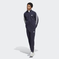 Basic 3-Stripes French Terry Track Suit. Niebieskie spodnie dresowe męskie Adidas, bez wzorów, z dresówki. Za 268.99 zł.