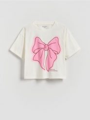 Luźny t-shirt z nadrukiem - złamana biel. Koszulki dziewczęce Reserved, bez wzorów, z bawełny, bez ramiączek. Za 25.99 zł.