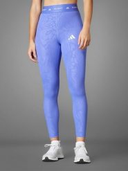 Adidas Legginsy sportowe w kolorze fioletowym rozmiar: XS. Różowe legginsy damskie Adidas, xs, bez wzorów, z materiału. Za 91.99 zł.