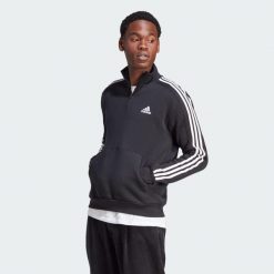 Bluza Essentials Fleece 3-Stripes 1/4-Zip. Czarne bluzy bez kaptura męskie Adidas, s, z materiału. Za 223.99 zł.