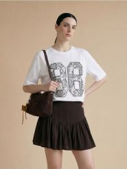 Bawełniana koszulka z napisem 86 - biały. Białe t-shirty damskie Sinsay, l, bez wzorów, z bawełny, bez kołnierzyka. Za 25.99 zł.