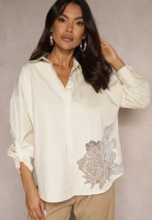Ciemnobeżowa Koszula z Bawełny Ozdobiona Ażurową Wstawką Donivessa. Brązowe koszule damskie Renee, l, w ażurowe wzory, z bawełny, eleganckie, bez kołnierzyka, bez ramiączek. Za 59.99 zł.
