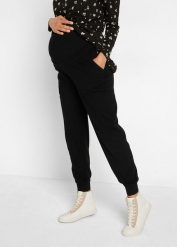 Spodnie ciążowe i na okres po porodzie, z miękkiej dzianiny. Czarne spodnie materiałowe damskie bonprix, bez wzorów, z dzianiny, moda ciążowa. Za 147.99 zł.