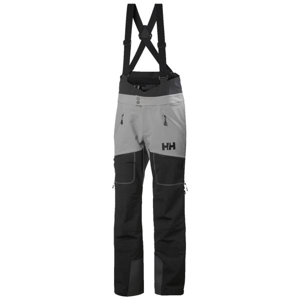 Spodnie narciarskie typu ogrodniczki Helly Hansen Odin BC Softshell. Niebieskie spodnie materiałowe męskie Helly Hansen, bez wzorów, z softshellu, sportowe. W wyprzedaży za 1,403.50 zł.