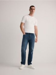Jeansy straight fit z efektem sprania - granatowy. Niebieskie jeansy męskie Reserved. W wyprzedaży za 89.99 zł.