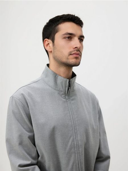 Sportowa marynarka - jasnoszary. Szare kurtki męskie Reserved, bez wzorów, z tkaniny. Za 249.99 zł.