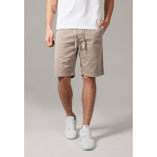 Szorty Urban Classic stretch twill jogg. Białe szorty męskie Urban Classics, bez kołnierzyka. Za 175.50 zł.