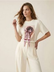 Bawełniana koszulka z dekoracyjną kokardą - kremowy. Białe t-shirty damskie Sinsay, l, bez wzorów, z bawełny, bez kołnierzyka. Za 25.99 zł.