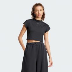 Koszulka City Escape Baby. Czarne bluzki sportowe damskie Adidas, xl, z materiału, bez kołnierzyka, bez ramiączek. W wyprzedaży za 83.40 zł.