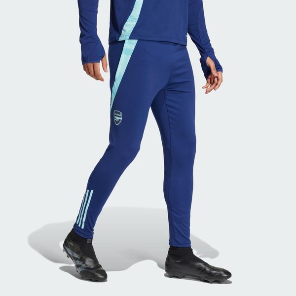 Spodnie Arsenal Tiro 24 Training. Niebieskie spodnie materiałowe męskie Adidas, bez wzorów, z materiału, sportowe. W wyprzedaży za 215.30 zł.