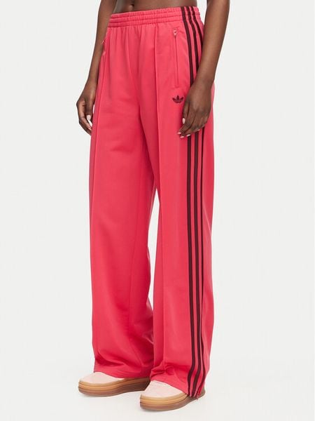 Adidas Spodnie dresowe Firebird Loose Tracksuit KW0228 Różowy Loose Fit. Czerwone spodnie dresowe damskie Adidas, xs, bez wzorów, z dresówki. Za 299.99 zł.