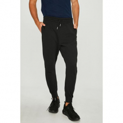 Reebok Classic - Spodnie. Czarne spodnie materiałowe męskie Reebok Classic, bez wzorów, z bawełny, casualowe, z podwyższonym stanem. W wyprzedaży za 199.90 zł.