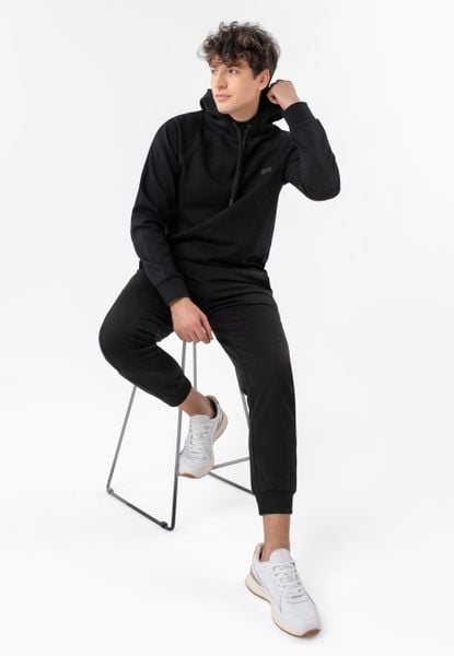 Dresowe spodnie N-PILO. Czarne spodnie dresowe męskie Volcano, bez wzorów, z bawełny. Za 139.99 zł.