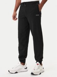 Guess Spodnie dresowe Z6RB12 KAIJ1 Czarny Regular Fit. Czarne spodnie dresowe męskie Guess, z aplikacjami, z bawełny. Za 299.99 zł.