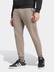 Adidas Spodnie dresowe w kolorze jasnobrązowym rozmiar: XL. Brązowe spodnie dresowe męskie Adidas, bez wzorów, z dresówki. Za 144.92 zł.