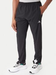 Adidas Spodnie dresowe Training Essentials Holiday JM5441 Czarny Regular Fit. Czarne spodnie dresowe męskie Adidas, bez wzorów, z dresówki. Za 258.99 zł.