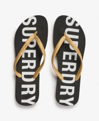 Superdry Klapki Code Essential z gumy – Czarny/Złoto metaliczne. Czarne klapki damskie Superdry., bez wzorów, z gumy, bez obcasa. Za 104.55 zł.