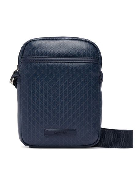 Calvin Klein Saszetka Emblem Aop Coated Slim Reporter LV04D3334G Granatowy. Niebieskie saszetki męskie CALVIN KLEIN, ze skóry. Za 369.99 zł.