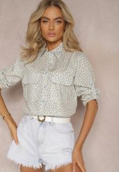 Jasnoniebieska Koszula z Bawełny o Luźnym Kroju w Drobne Kwiaty Findiana. Niebieskie koszule damskie Renee, na lato, l, bez wzorów, z bawełny, eleganckie, bez kołnierzyka, bez ramiączek. Za 39.99 zł.
