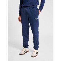 Spodnie do biegania Hummel Legacy 2.0. Niebieskie spodnie dresowe męskie HUMMEL, na lato, bez wzorów, z dresówki. Za 261.50 zł.