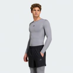 Koszulka TECHFIT Compression Training Long Sleeve. Niebieskie t-shirty sportowe męskie Adidas, l, z dzianiny, bez ramiączek, techfit (adidas). Za 152.15 zł.