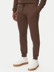 Guess Spodnie dresowe Z2YB22 K9V31 Brązowy Regular Fit. Brązowe spodnie dresowe męskie Guess, z aplikacjami, z bawełny. Za 294.99 zł.