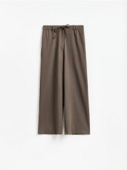 Spodnie z wiązaniem - brązowy. Brązowe spodnie materiałowe damskie Reserved, bez wzorów, z tkaniny. Za 139.99 zł.