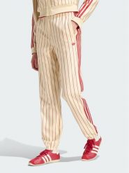 Adidas Spodnie dresowe Pinstripe Firebird Track Ptan KT1851 Kremowy Regular Fit. Białe spodnie dresowe damskie Adidas, xs, bez wzorów, z dresówki. Za 399.99 zł.