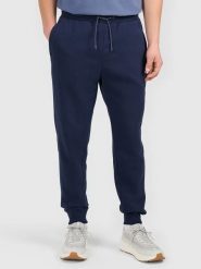 4F Spodnie dresowe w kolorze granatowym rozmiar: M. Niebieskie spodnie dresowe męskie 4f, bez wzorów, z dresówki. Za 74.46 zł.