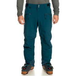 Spodnie snowboardowe męskie Quiksilver Boundry. Niebieskie spodnie materiałowe męskie Quiksilver, bez wzorów, sportowe. W wyprzedaży za 668.45 zł.