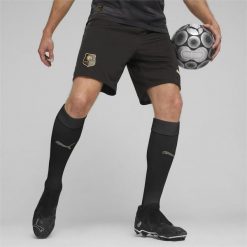 Szorty piłkarskie Stade Rennais F.C. PUMA Black Matte Gold Beige. Brązowe szorty męskie Puma, bez wzorów, klasyczne. Za 183.80 zł.