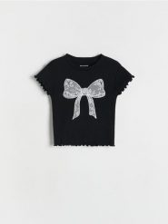 T-shirt z kokardką - czarny. Czarne koszulki dziewczęce Reserved, bez wzorów, z bawełny, bez ramiączek. W wyprzedaży za 25.99 zł.