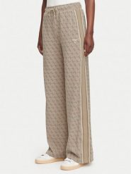 Guess Spodnie dresowe V6YB27 K5181 Beżowy Relaxed Fit. Brązowe spodnie dresowe damskie Guess, m, z aplikacjami, z dresówki. Za 474.99 zł.