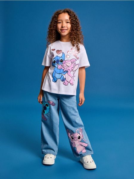 Bawełniana koszulka Stitch - biały. Białe koszulki dziewczęce Sinsay, l, bez wzorów, z bawełny, bez ramiączek. Za 15.99 zł.