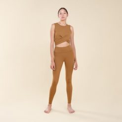 Legginsy do jogi damskie Kimjaly Premium. Brązowe legginsy damskie KIMJALY, s, bez wzorów, z elastanu. W wyprzedaży za 149.99 zł.