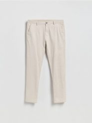 Spodnie chino slim - beżowy. Brązowe spodnie materiałowe męskie Reserved, bez wzorów, z bawełny. Za 159.99 zł.