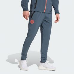 FC Bayern Tiro 25 Competition Vis Tech Travel Pants. Brązowe spodnie dresowe męskie Adidas, bez wzorów, z dresówki. Za 329.00 zł.