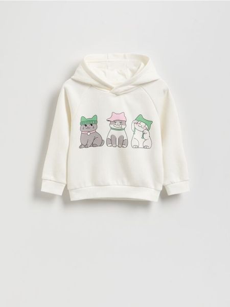 Bluza z nadrukiem - złamana biel. Bluzy i bluzki niemowlęce Reserved, bez wzorów, z bawełny, bez ramiączek, bez kaptura. Za 49.99 zł.