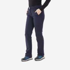 Spodnie turystyczne damskie Quechua SH500 mountain. Niebieskie spodnie materiałowe damskie QUECHUA, bez wzorów, z elastanu, sportowe. Za 199.99 zł.