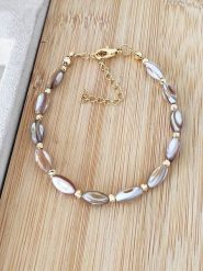 Nakkash Pozłacana bransoletka z masą perłową rozmiar: onesize. Brązowe bransoletki damskie Nakkash, pozłacane. Za 30.99 zł.