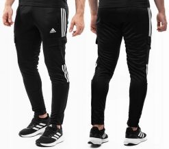 Spodnie męskie adidas Tiro Cargo. Czarne spodnie materiałowe męskie Adidas, bez wzorów, z materiału. Za 229.99 zł.