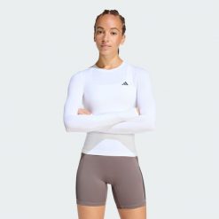 Bluzka z długim rękawem PrimeLift Essentials Workout Contour. Białe bluzki sportowe damskie Adidas, bez kołnierzyka, bez ramiączek. Za 149.00 zł.