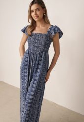 Niebieski Letni Kombinezon Casual z Wiskozy w Etno Haft z Falbankami Paninna. Niebieskie kombinezony damskie Born2be, na lato, l, bez wzorów, z tkaniny, boho, bez kołnierzyka, bez ramiączek, długie. Za 109.99 zł.