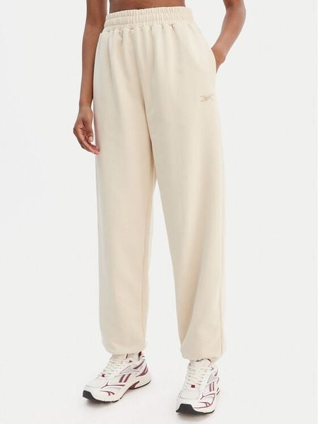 Reebok Spodnie dresowe Reebok x Ewa Chodakowska RK25621CCW Beżowy Relaxed Fit. Brązowe spodnie dresowe damskie Reebok, s, bez wzorów, z dresówki. Za 199.99 zł.